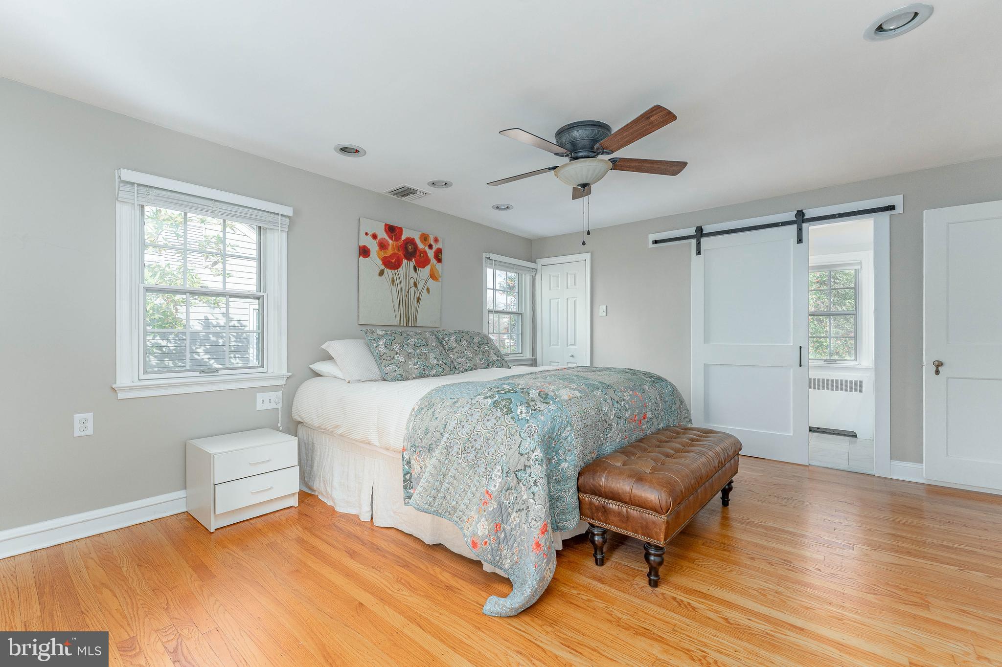 111 Harrogate Road Wynnewood, PA 19096 - Photo 28 of 60 a bedroom with a bed and a chair