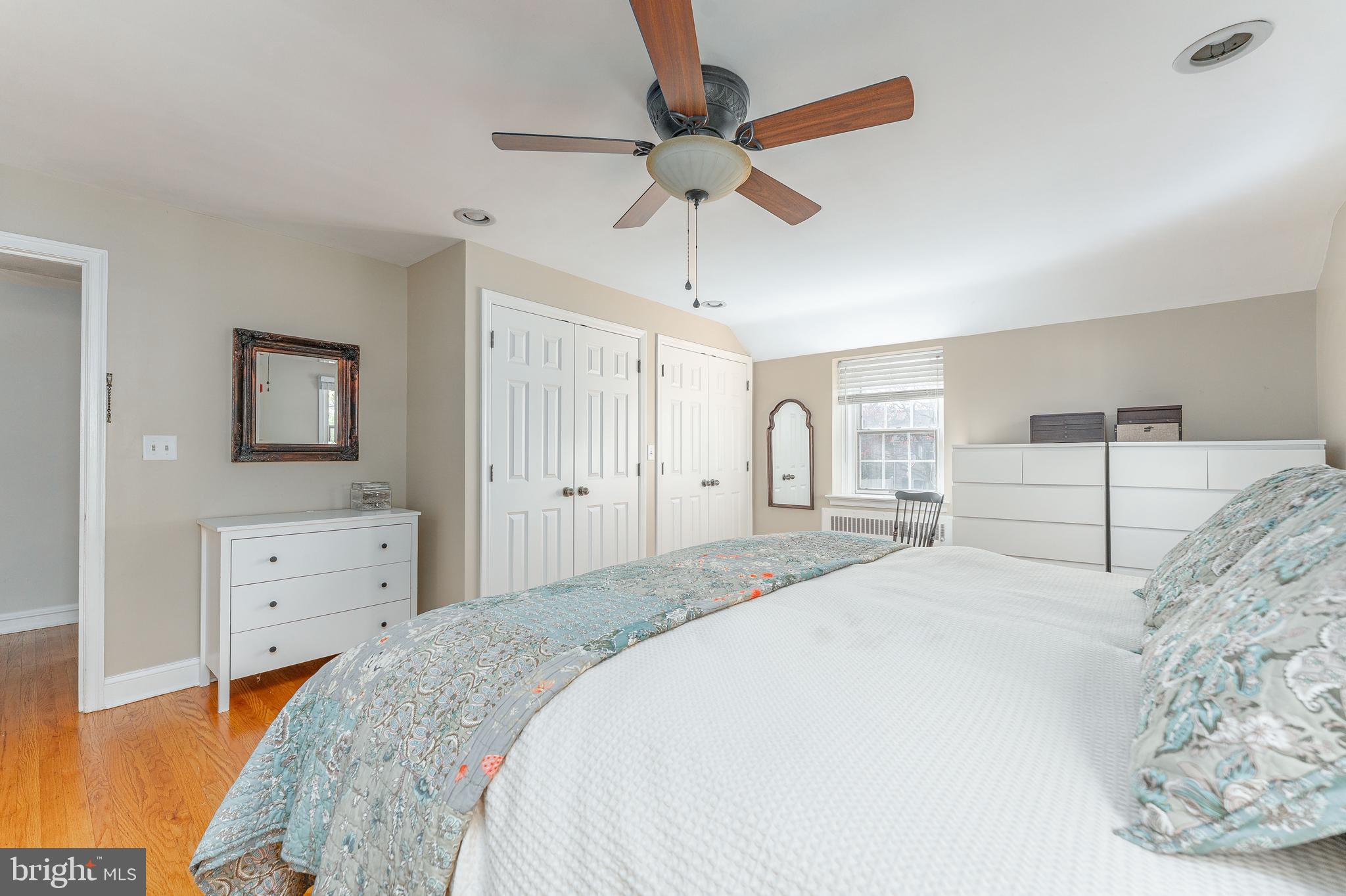 111 Harrogate Road Wynnewood, PA 19096 - Photo 30 of 60 a bedroom with a bed and a chandelier