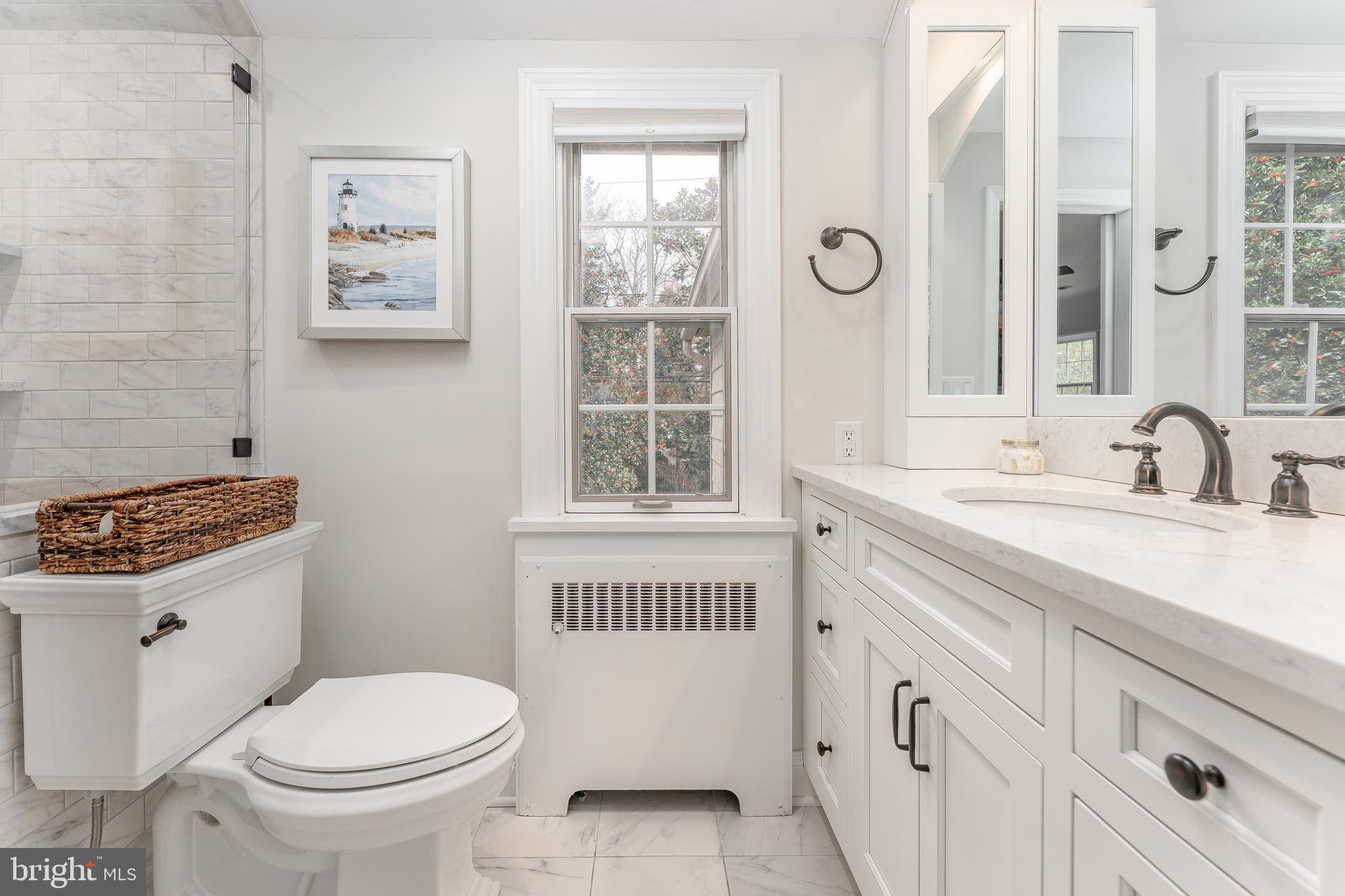111 Harrogate Road Wynnewood, PA 19096 - Photo 31 of 60 a bathroom with a granite countertop toilet sink and a window