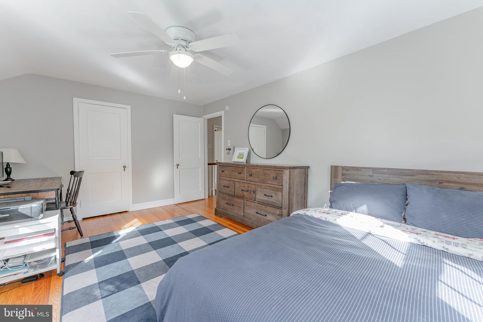 111 Harrogate Road Wynnewood, PA 19096 - Photo 43 of 60 a bedroom with a bed closet and wooden floor
