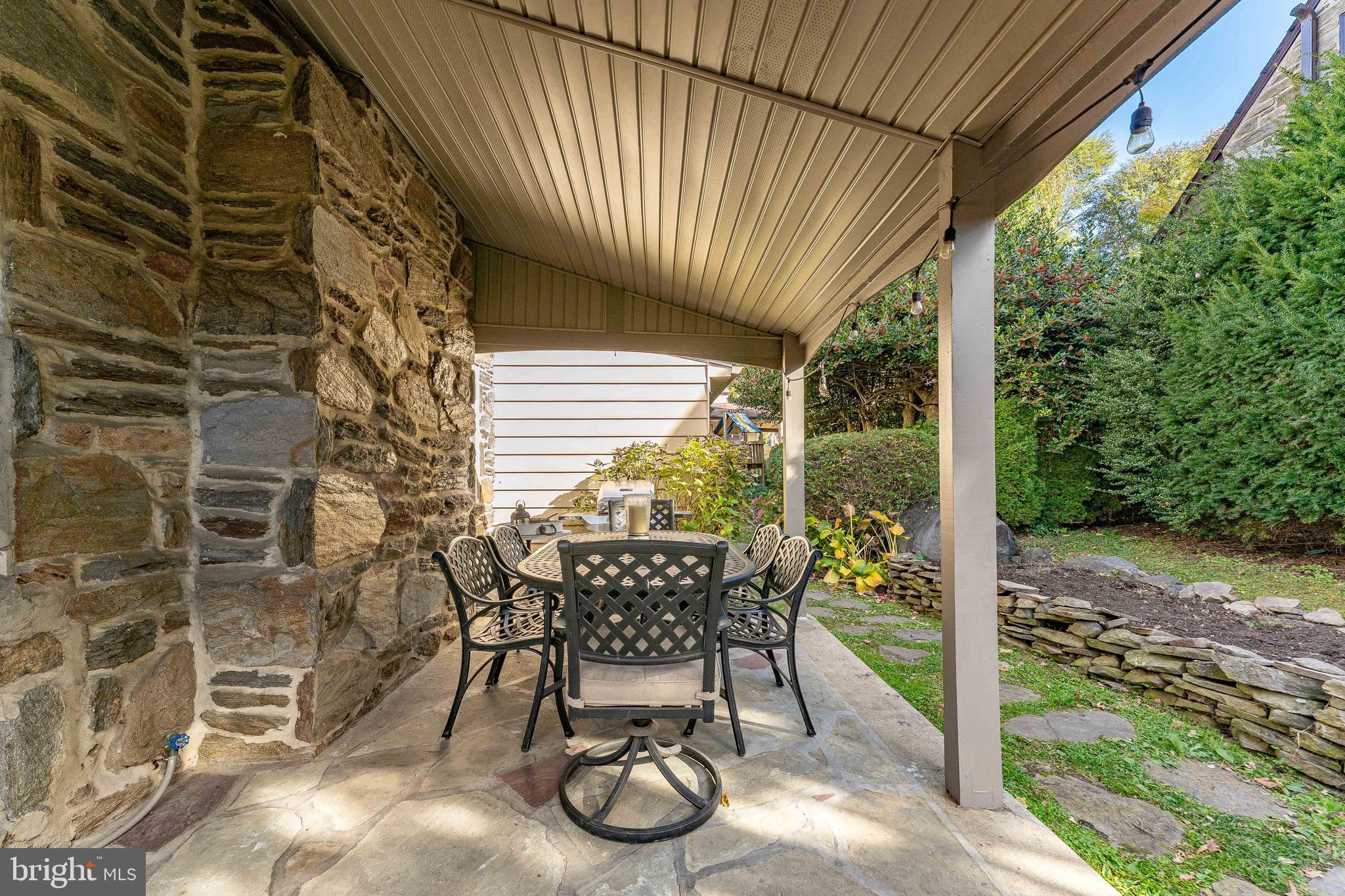 111 Harrogate Road Wynnewood, PA 19096 - Photo 53 of 60 a view of a patio with table and chairs and potted plants