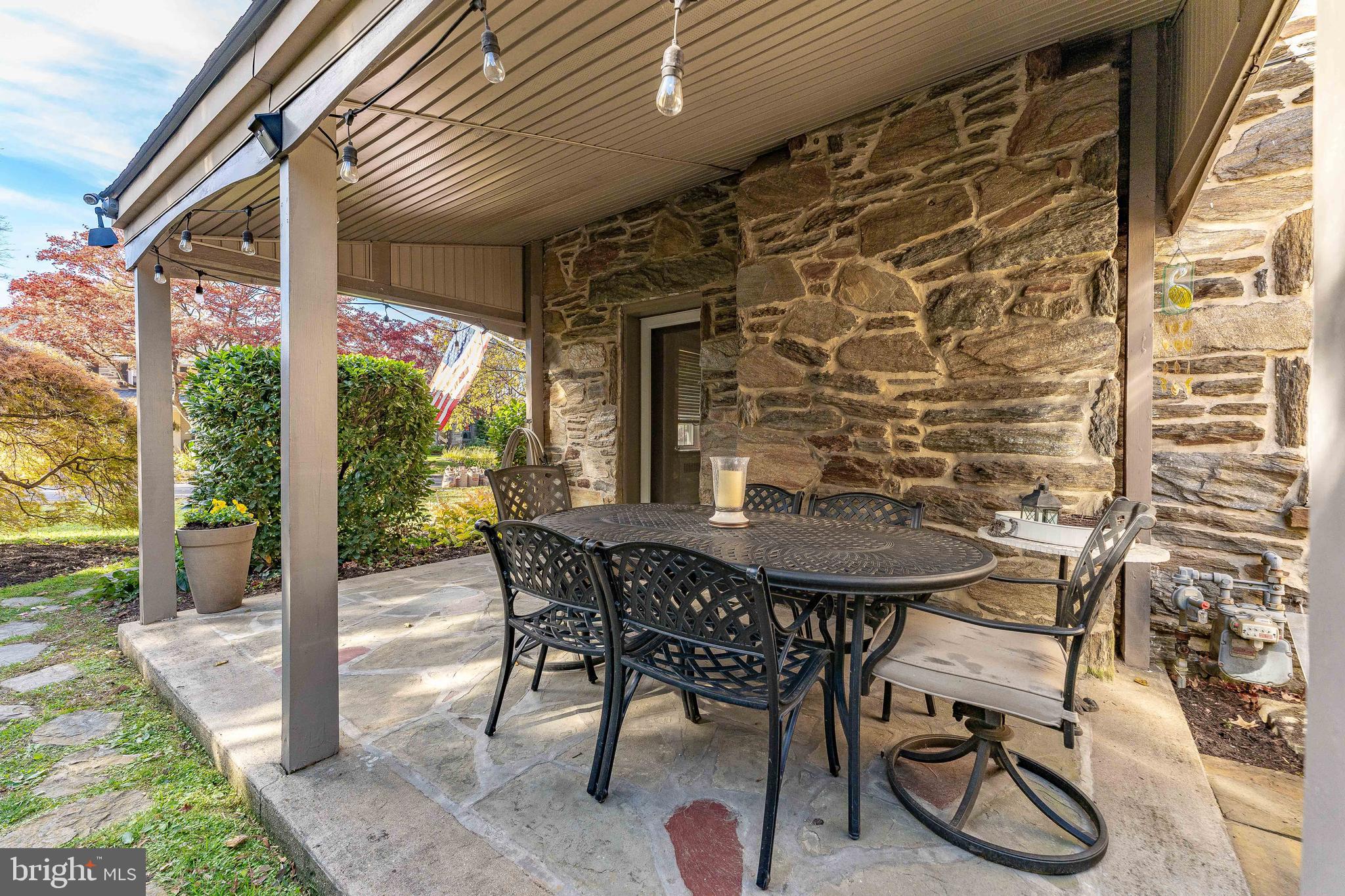 111 Harrogate Road Wynnewood, PA 19096 - Photo 54 of 60 a view of an outdoor dining space with a table and chairs