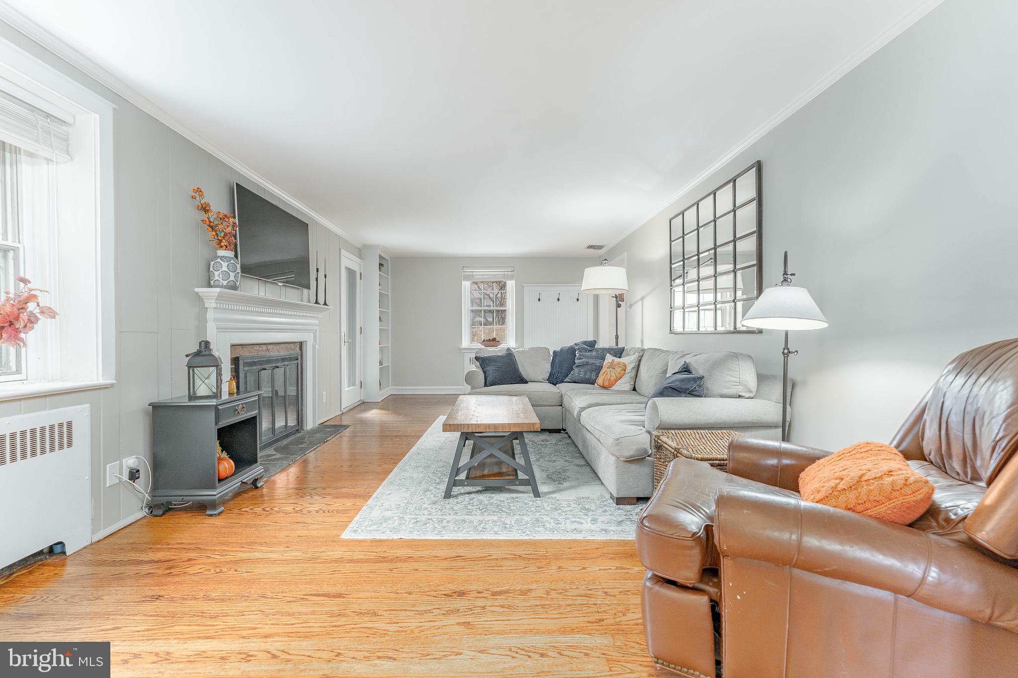 111 Harrogate Road Wynnewood, PA 19096 - Photo 7 of 60 a living room with furniture and a fireplace