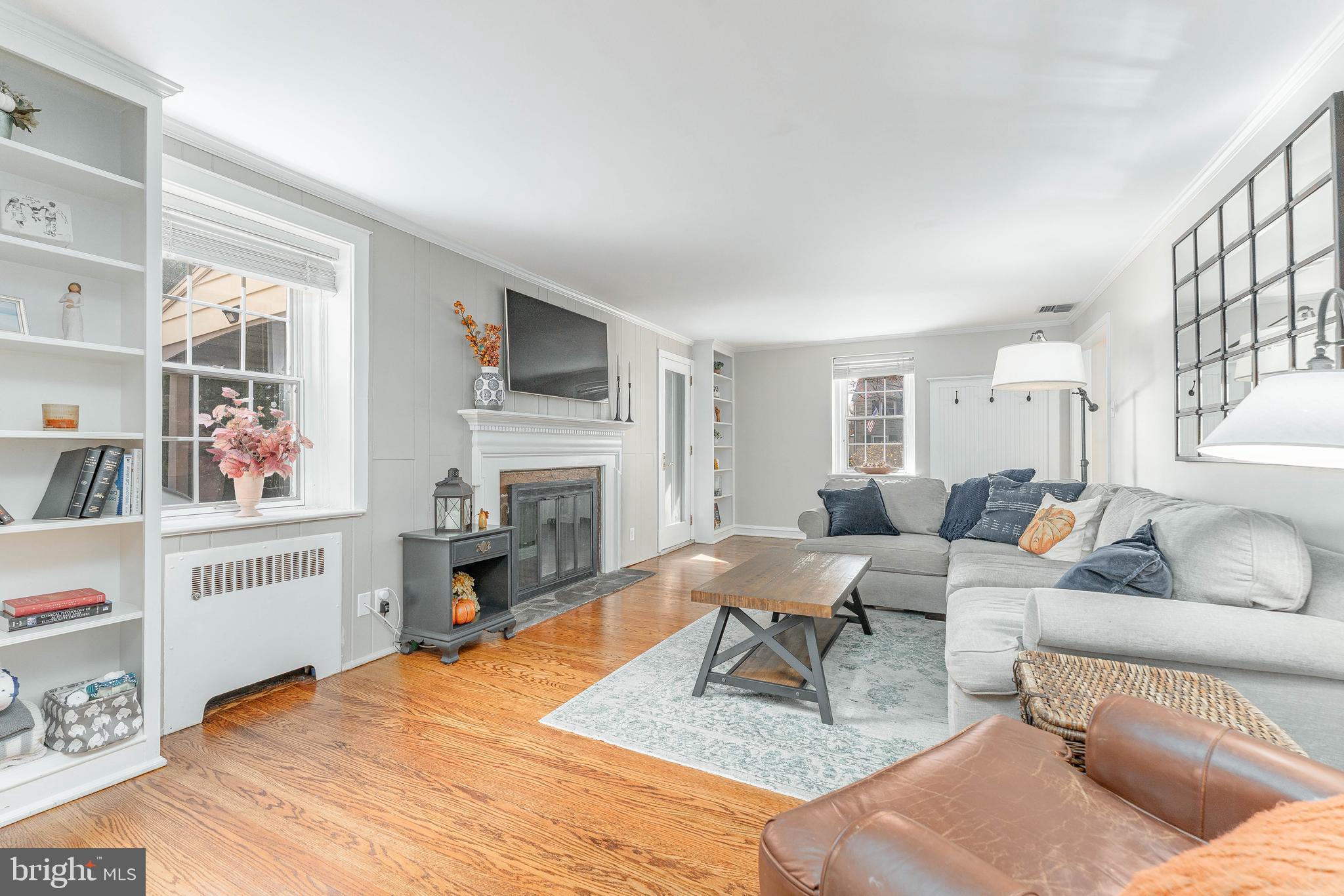 111 Harrogate Road Wynnewood, PA 19096 - Photo 8 of 60 a living room with furniture a fireplace and a flat screen tv
