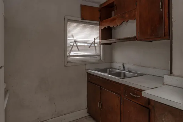 a kitchen with a sink and cabinets