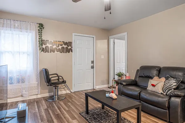 a living room with furniture and a window
