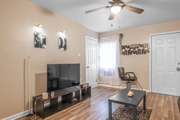 a living room with furniture and a flat screen tv