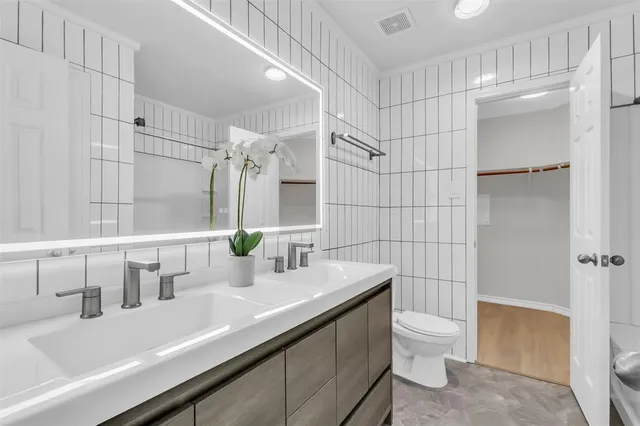 a bathroom with a sink and toilet