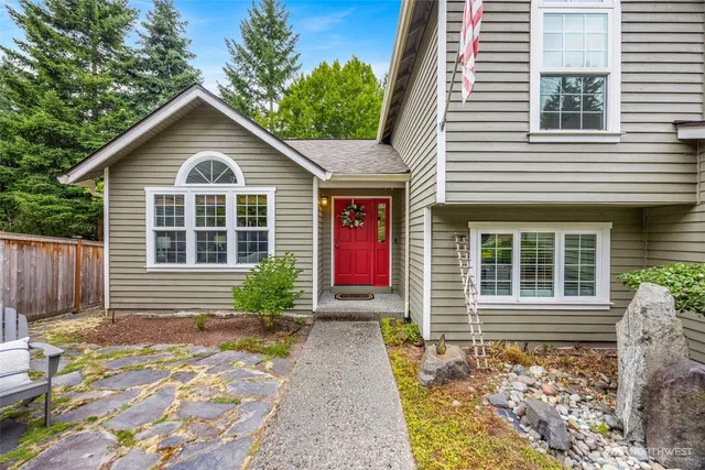 a front view of a house with garden