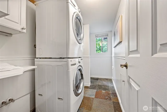 a view of a chairs and table in the balcony
