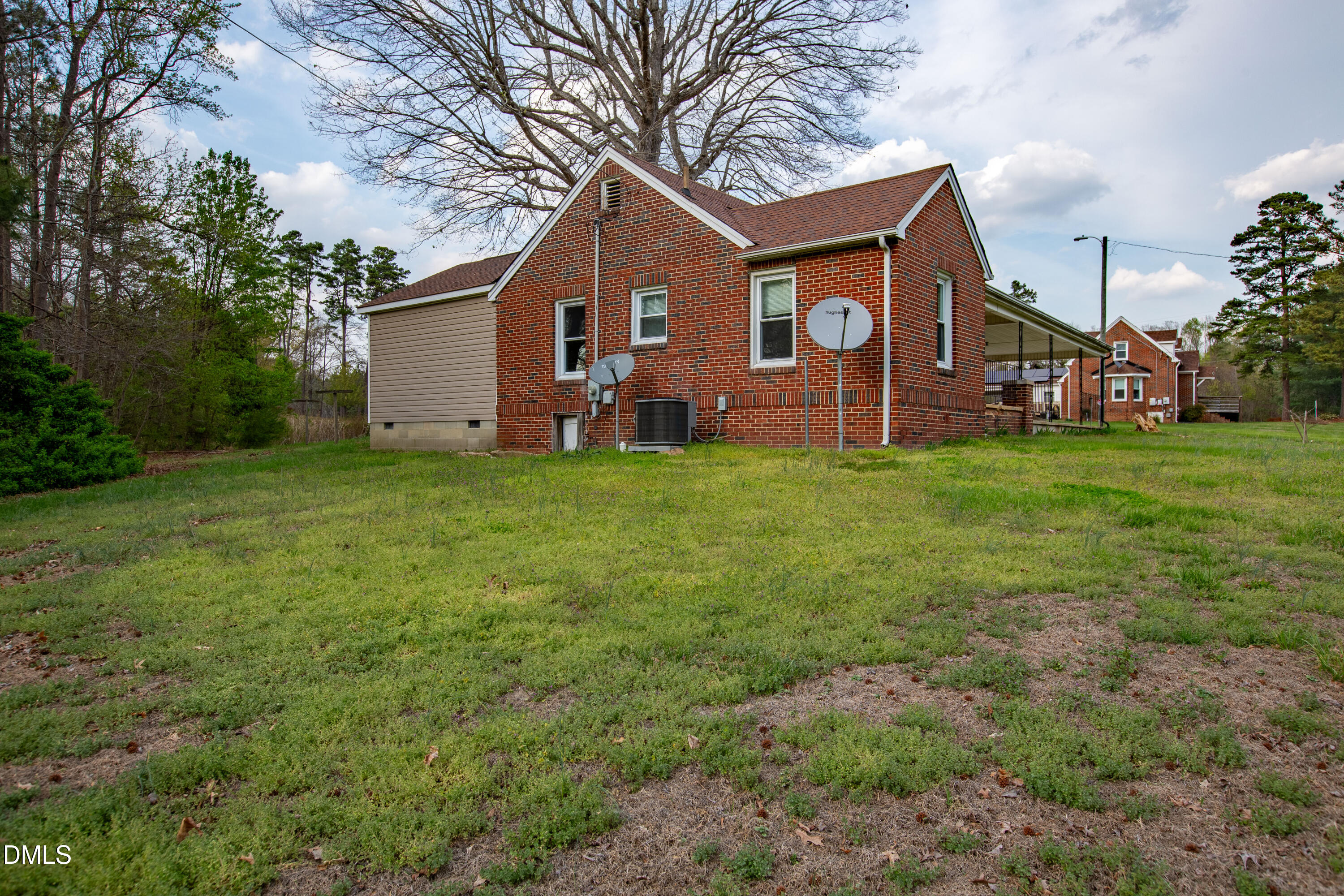 4295 Virgilina Road Roxboro, NC 27574 - Photo 41 of 46 a view of a house with a big yard and large trees