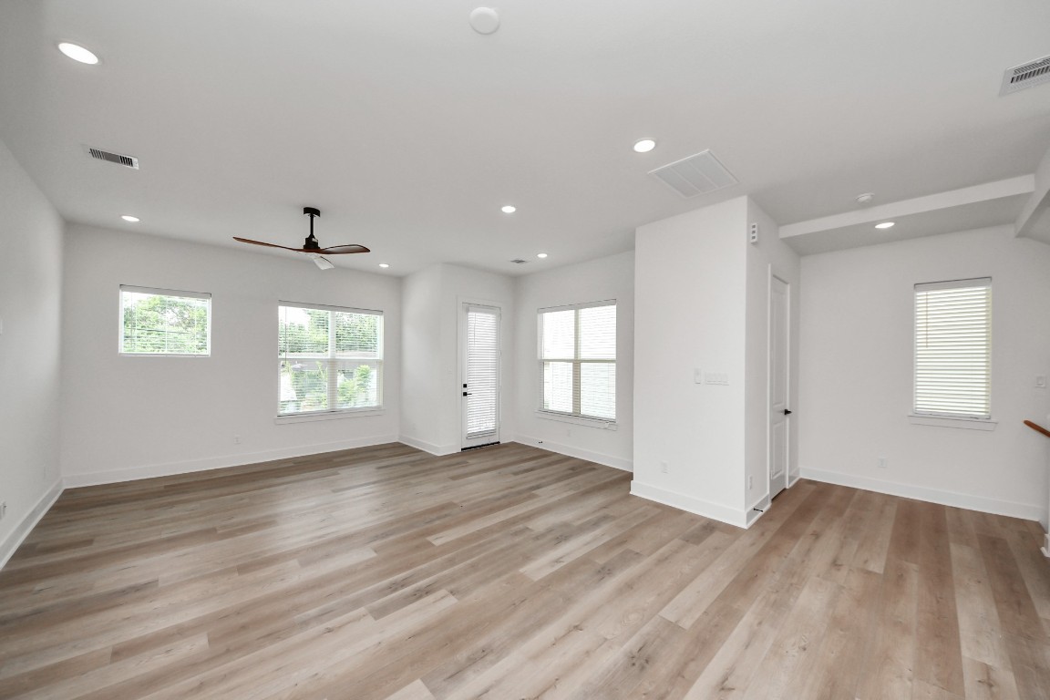3313 Daphne Street Houston, TX 77021 - Photo 15 of 34 an empty room with wooden floor and windows