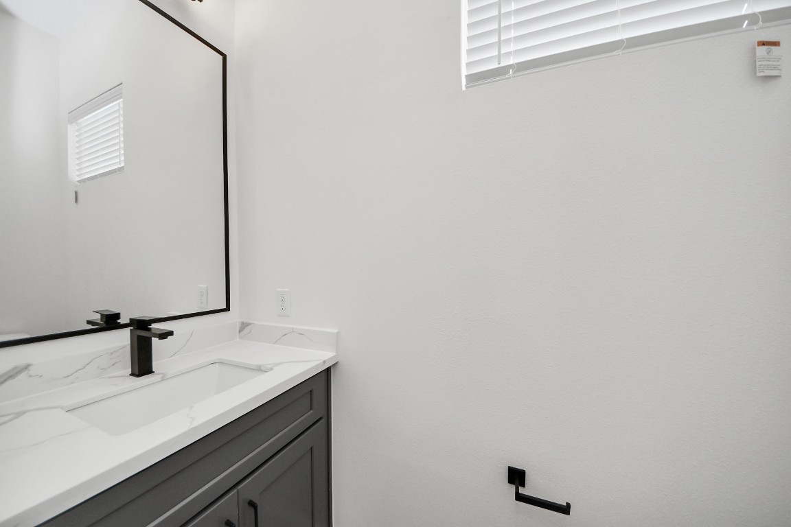3313 Daphne Street Houston, TX 77021 - Photo 17 of 34 a bathroom with a sink and vanity
