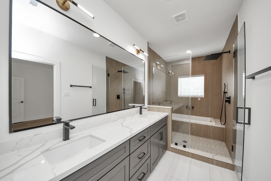 3313 Daphne Street Houston, TX 77021 - Photo 23 of 34 a bathroom with a tub sink shower and mirror