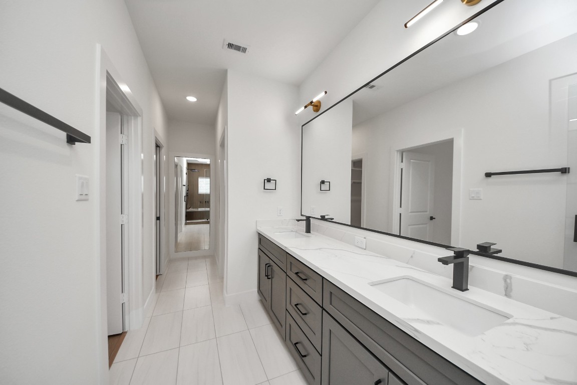 3313 Daphne Street Houston, TX 77021 - Photo 24 of 34 a spacious bathroom with a double vanity sink mirror and double