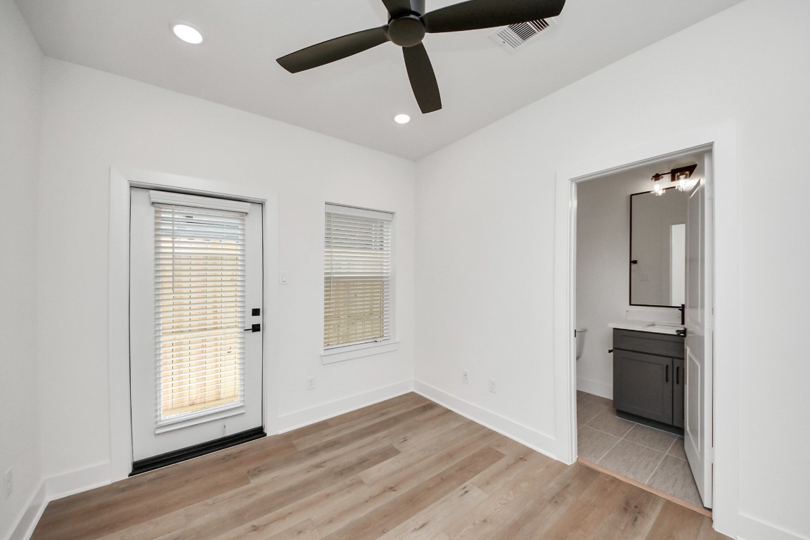 3313 Daphne Street Houston, TX 77021 - Photo 4 of 34 a view of empty room with wooden floor and window