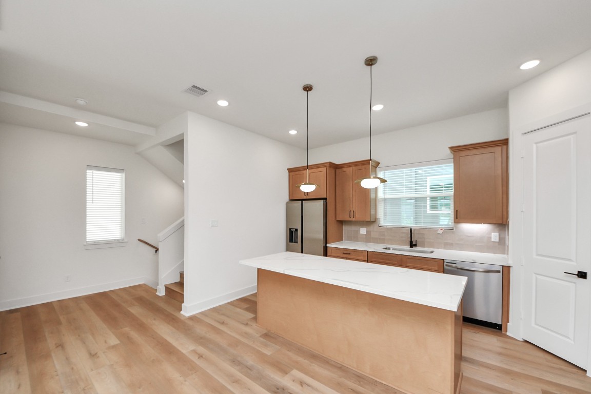 3313 Daphne Street Houston, TX 77021 - Photo 7 of 34 a large kitchen with kitchen island a sink stainless steel appliances and cabinets