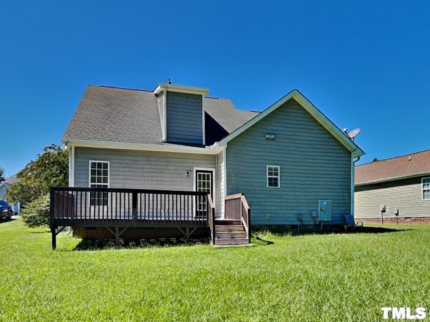 225 Bear Oak Drive Smithfield, NC 27577 - Photo 17 of 17 a view of a house with a yard and deck