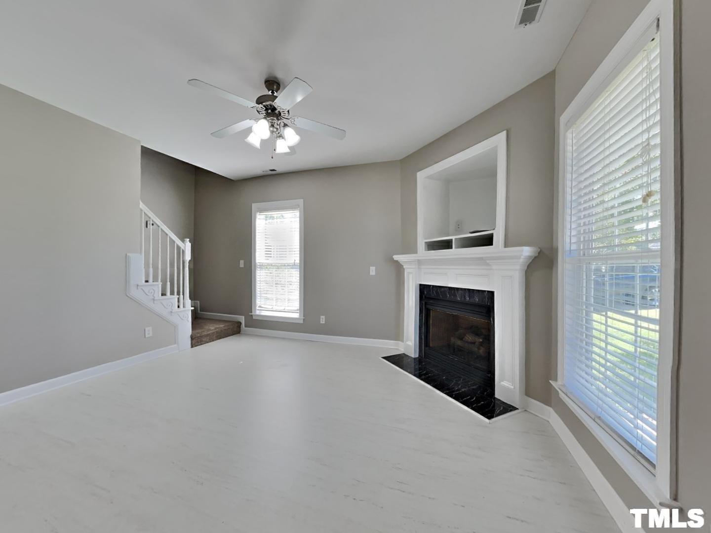 225 Bear Oak Drive Smithfield, NC 27577 - Photo 2 of 17 a view of an empty room with window and fireplace