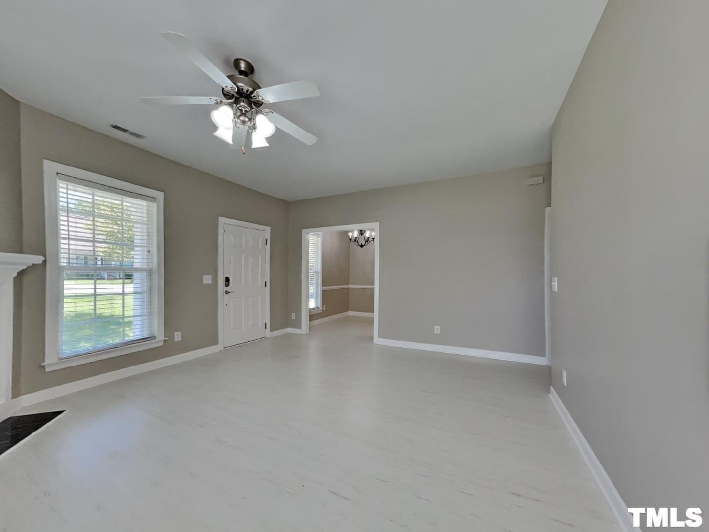 225 Bear Oak Drive Smithfield, NC 27577 - Photo 3 of 17 a view of an empty room with a window