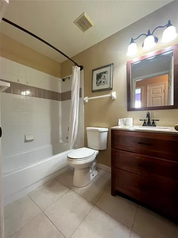 a bathroom with a toilet a sink and shower
