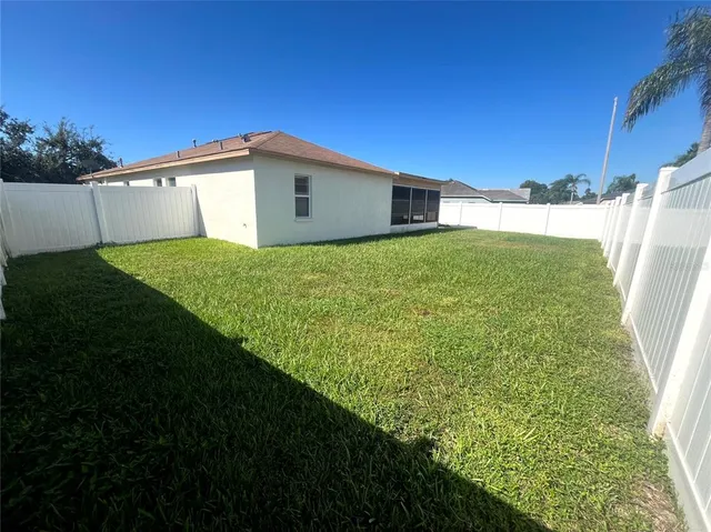 a view of a backyard with potted plants