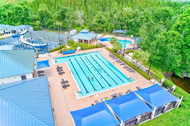 a view of a patio with table and chairs