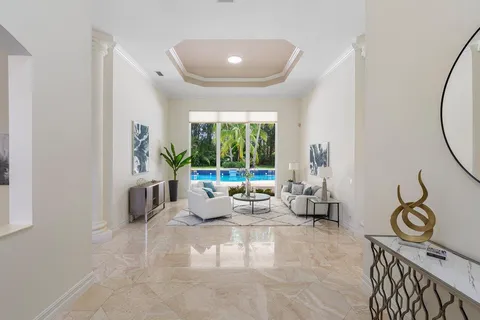 a kitchen with stainless steel appliances granite countertop a sink and a stove next to a window