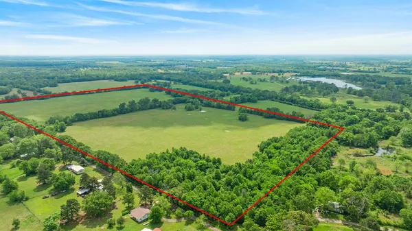 a view of a lake with a big yard