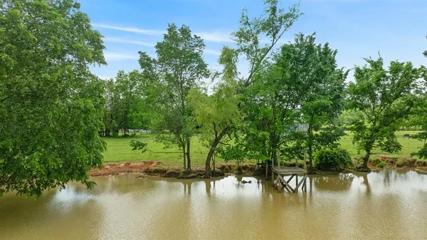 a view of swimming pool with a yard