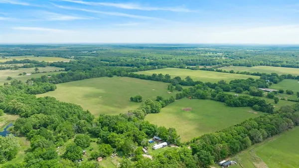 an aerial view of a golf course with a garden