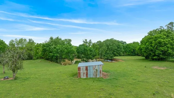 a backyard of a house with lots of green space