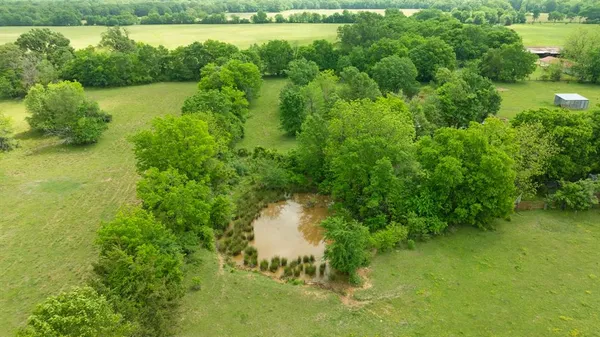 a view of a lake with a yard