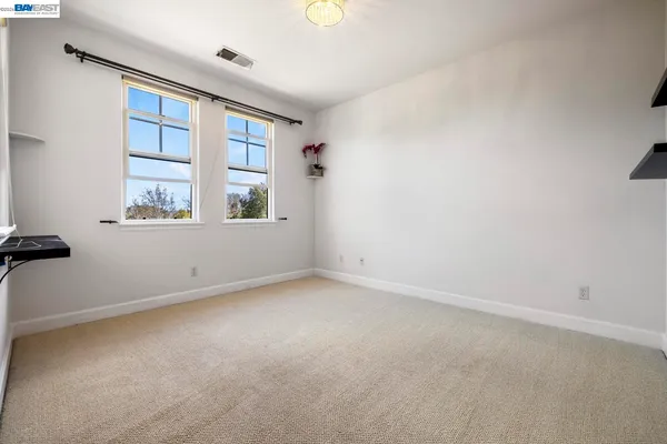 a kitchen with a refrigerator sink and cabinets