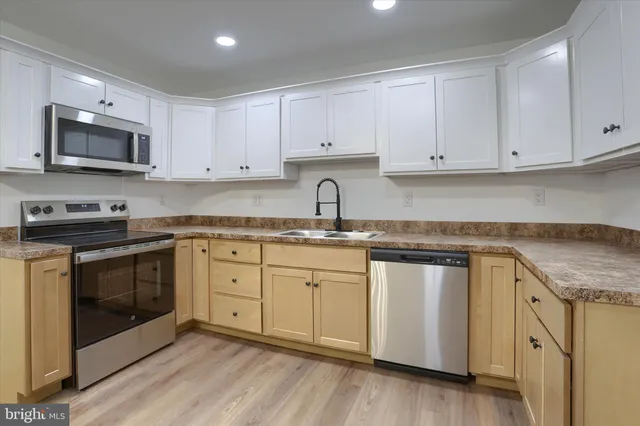 a bedroom with a bed table and window