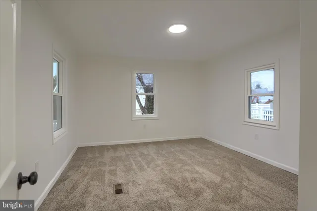 a bathroom with a sink mirror and vanity