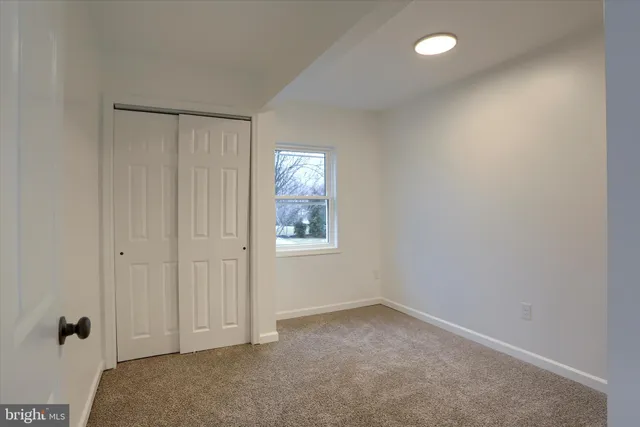 a view of empty room with windows