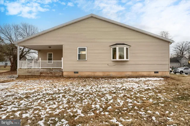 a view of a balcony with wooden floor
