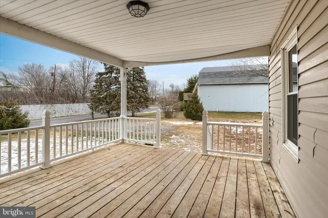 a view of a kitchen with a sink and a refrigerator