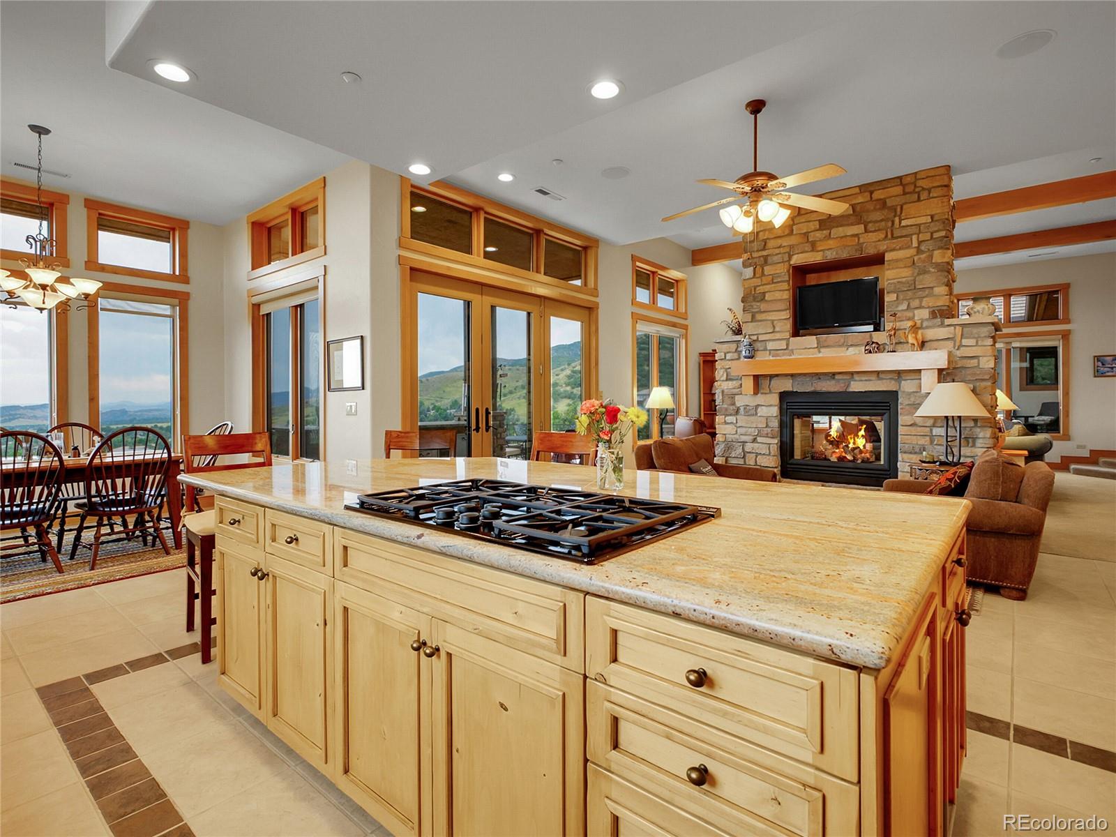 16285 Sandstone Drive Morrison, CO 80465 - Photo 11 of 47 a kitchen with a stove a sink and a refrigerator