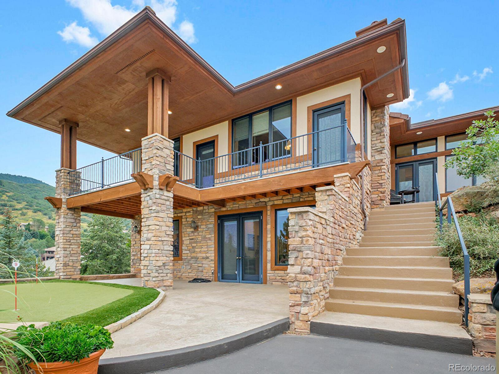 16285 Sandstone Drive Morrison, CO 80465 - Photo 17 of 47 a front view of a house with a yard