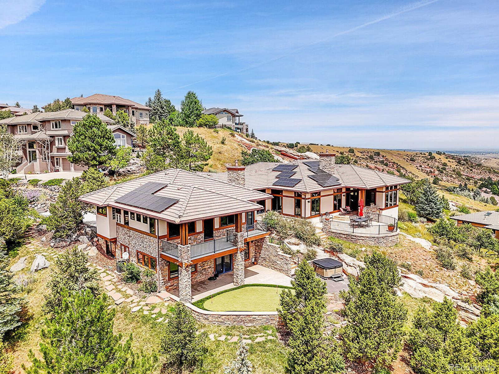 16285 Sandstone Drive Morrison, CO 80465 - Photo 2 of 47 an aerial view of a house with a big yard