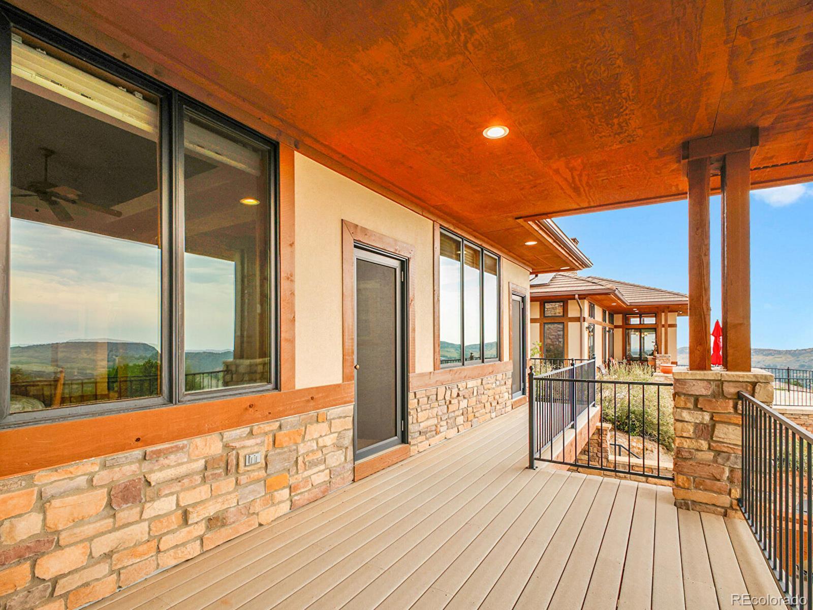 16285 Sandstone Drive Morrison, CO 80465 - Photo 24 of 47 a view of a house with a large window and wooden floor