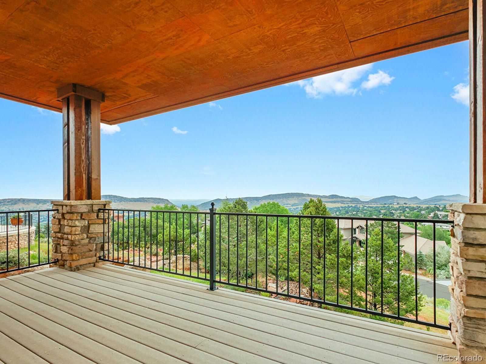 16285 Sandstone Drive Morrison, CO 80465 - Photo 25 of 47 a view of balcony with wooden floor and fence