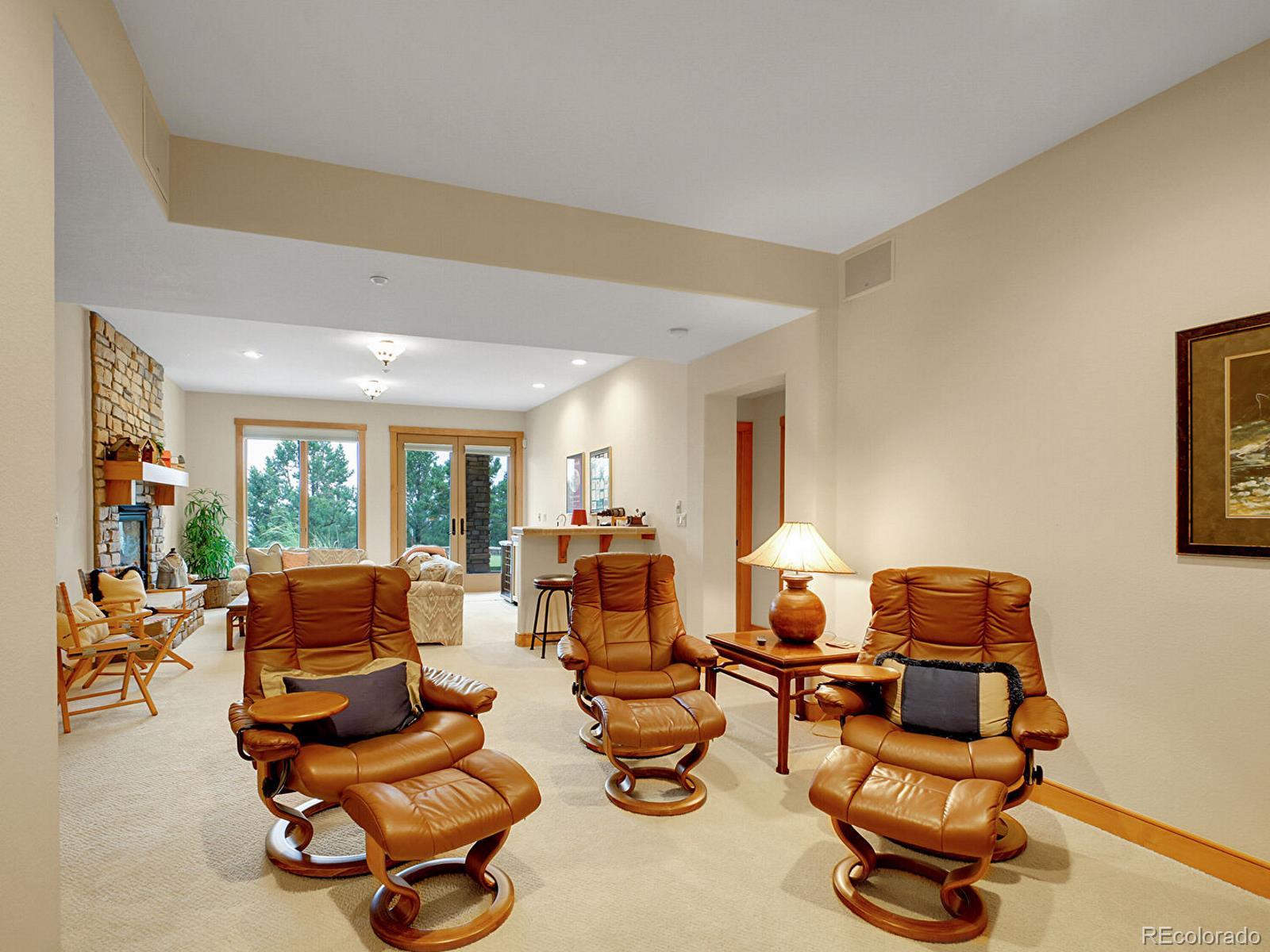 16285 Sandstone Drive Morrison, CO 80465 - Photo 30 of 47 a room with gym equipment