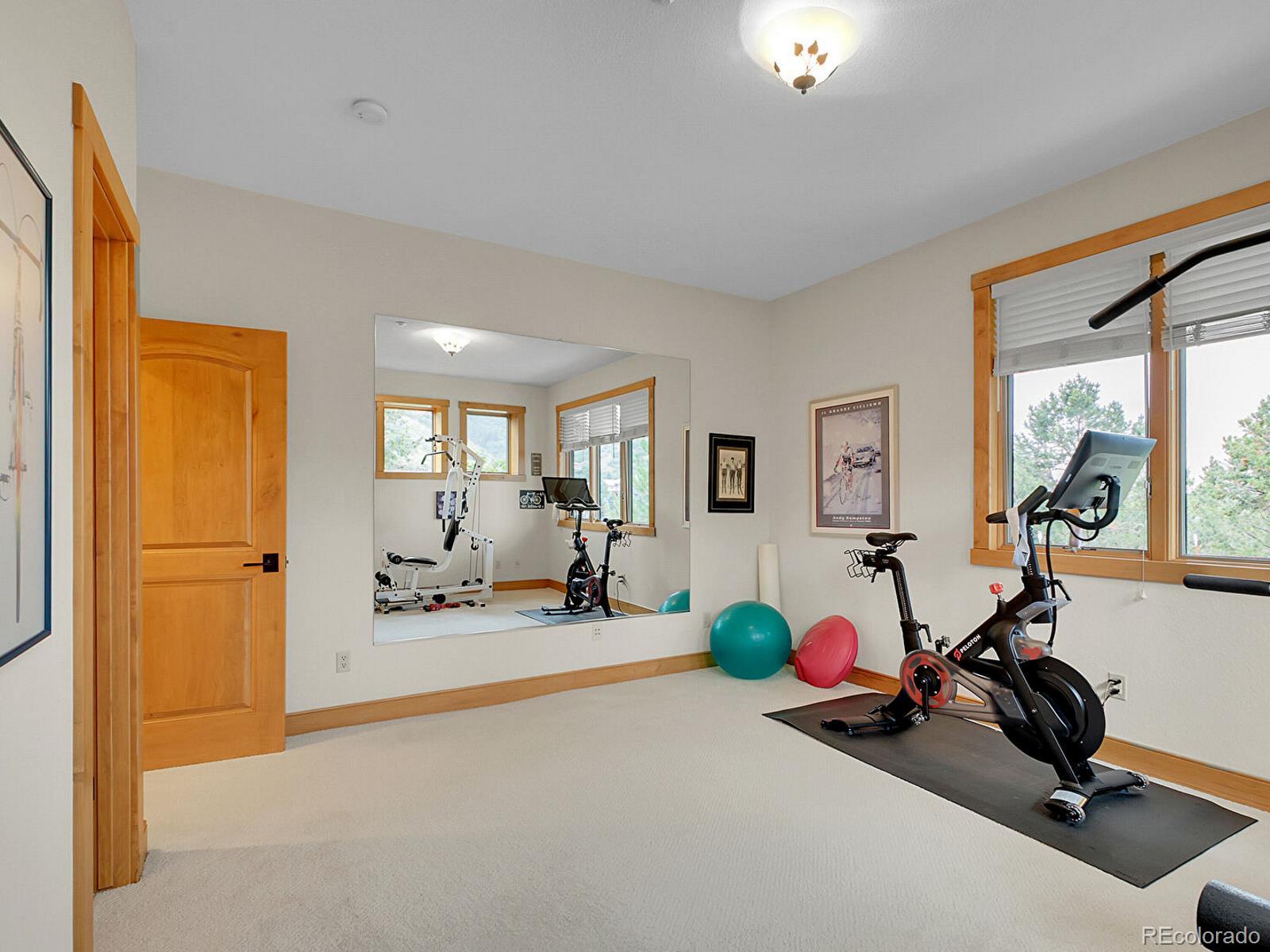 16285 Sandstone Drive Morrison, CO 80465 - Photo 34 of 47 a view of a room with gym equipment