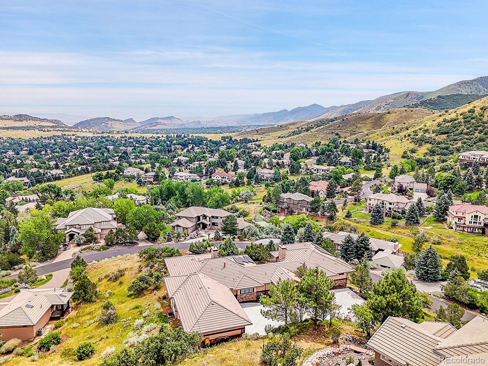 16285 Sandstone Drive Morrison, CO 80465 - Photo 39 of 47 an aerial view of residential houses with outdoor space and trees