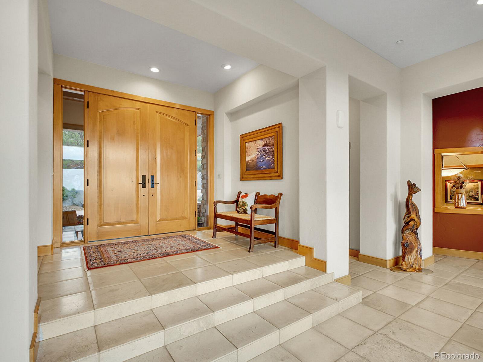 16285 Sandstone Drive Morrison, CO 80465 - Photo 5 of 47 a living room with furniture and large window