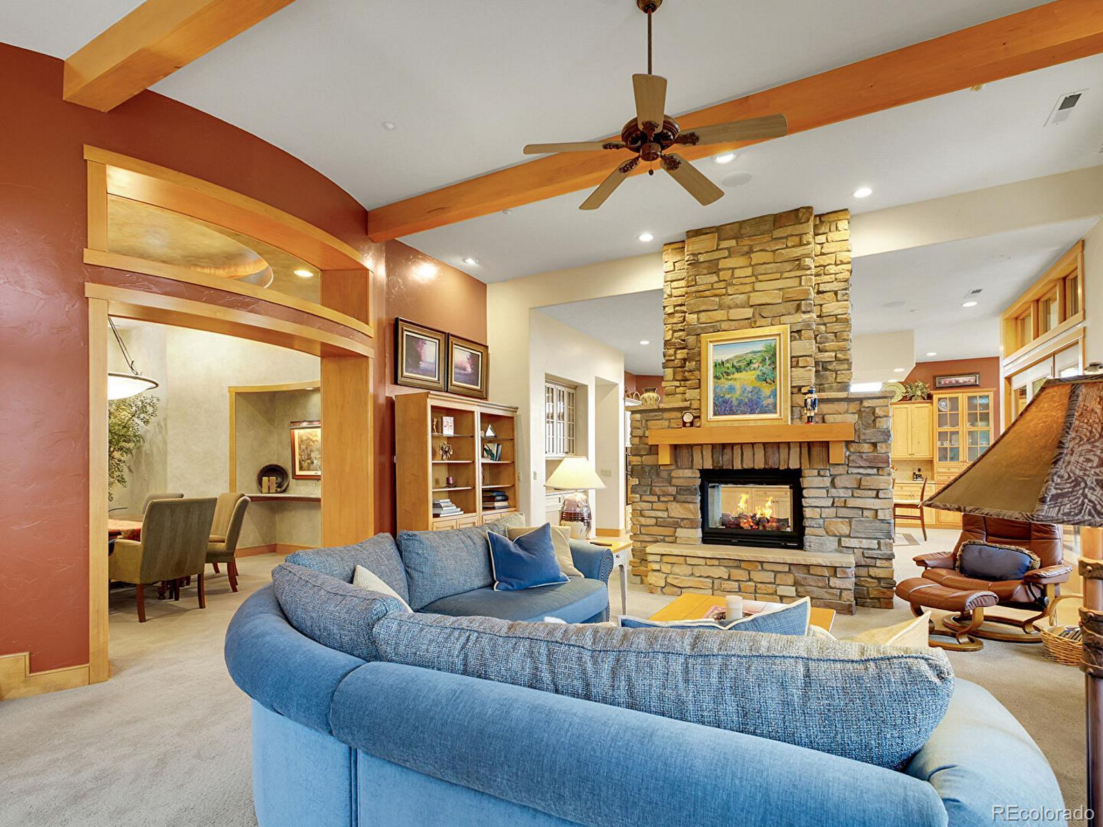 16285 Sandstone Drive Morrison, CO 80465 - Photo 7 of 47 a living room with furniture and a fireplace