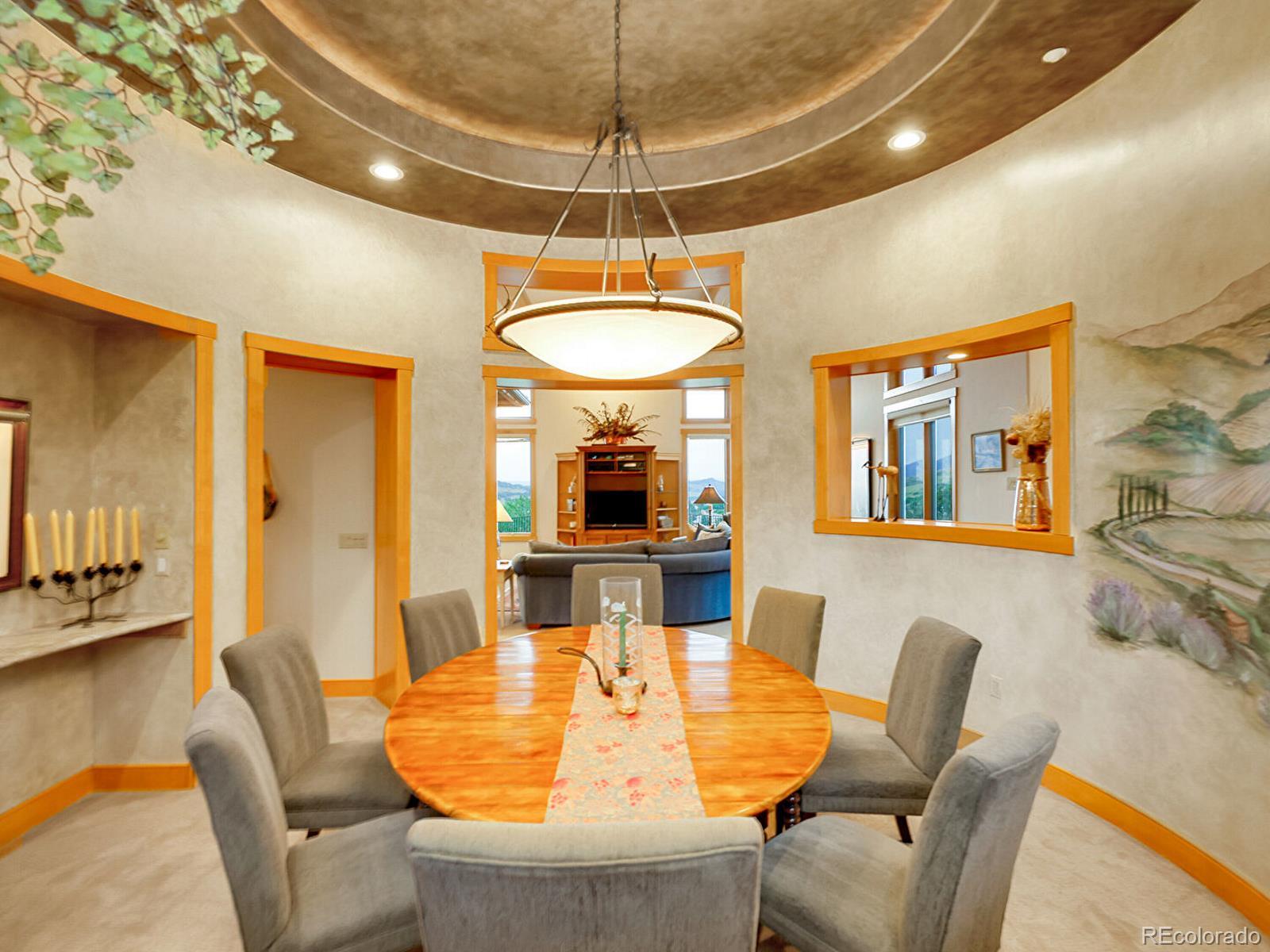 16285 Sandstone Drive Morrison, CO 80465 - Photo 8 of 47 a dining room with furniture and window
